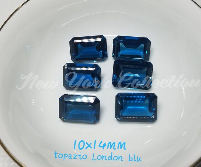 Topazio azzurro london blu taglio smeraldo 10x14mm.jpg